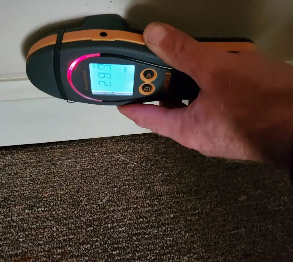 Moisture detection at baseboard during Storm Damage Restoration in Pontoon Beach